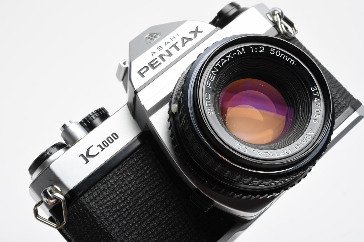 Pentax K1000 35mm SLR w/50mm f2 lens, New seals, canvas strap, Awesome