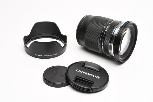 Olympus M. Zuiko Pro 12-200mm f3.5-6.3 lens, Caps, Hood, Mint-