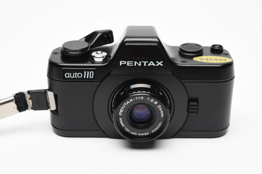 Pentax Auto 110 w/24mm f2.8, case, wrist strap, +AF130P Flash, Tested