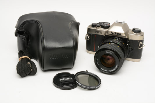 Nikon FM-10 35mm SLR w/35-70mm f3.5-4.8 zoom lens, cap+strap+pola, Great!