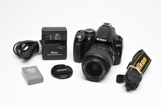 Nikon D3000 DSLR w/Nikkor AFS 18-55mm f3.5-5.6G VR Lens, Batt, Charger, Only 7807 Acts!