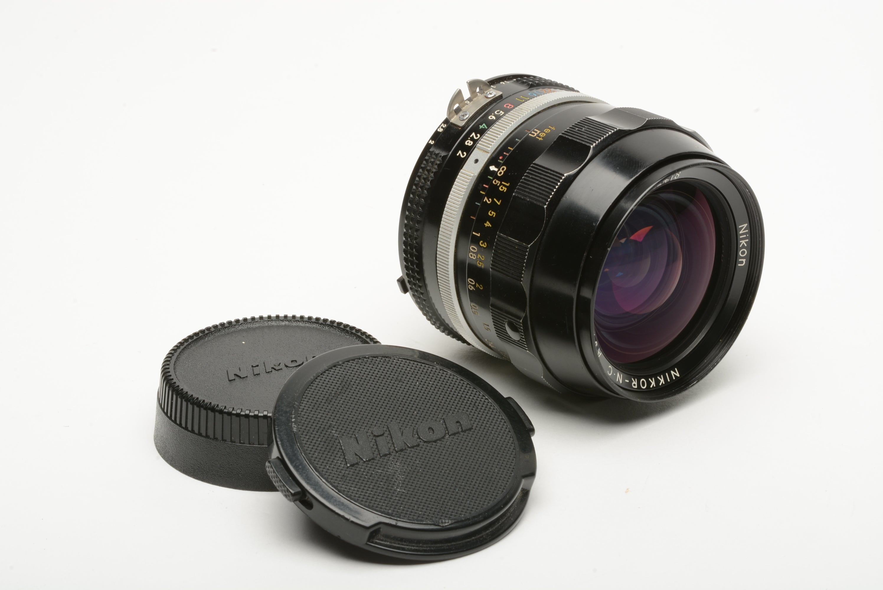 Nikon Nikkor MF 28mm F2 AI lens, caps, clean and sharp