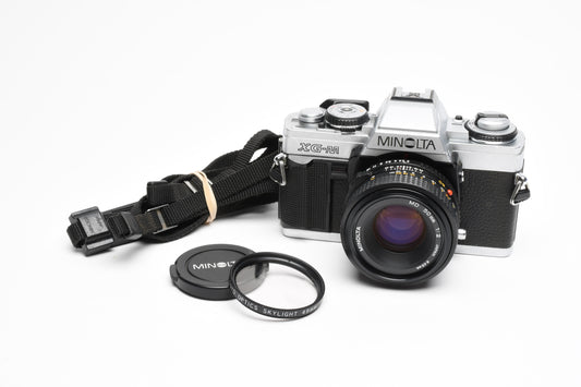 Minolta XG-M 35mm SLR w/50mm f2 lens, strap, new seals, cap, UV, Nice