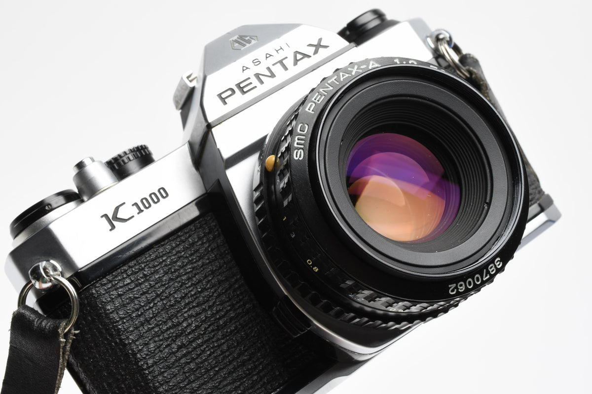 Pentax K1000 35mm SLR w/50mm f2 lens, New seals, strap, Great!