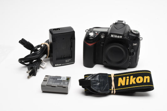 Nikon D90 DSLR body, batt, charger, strap, 2X books, 14K Acts