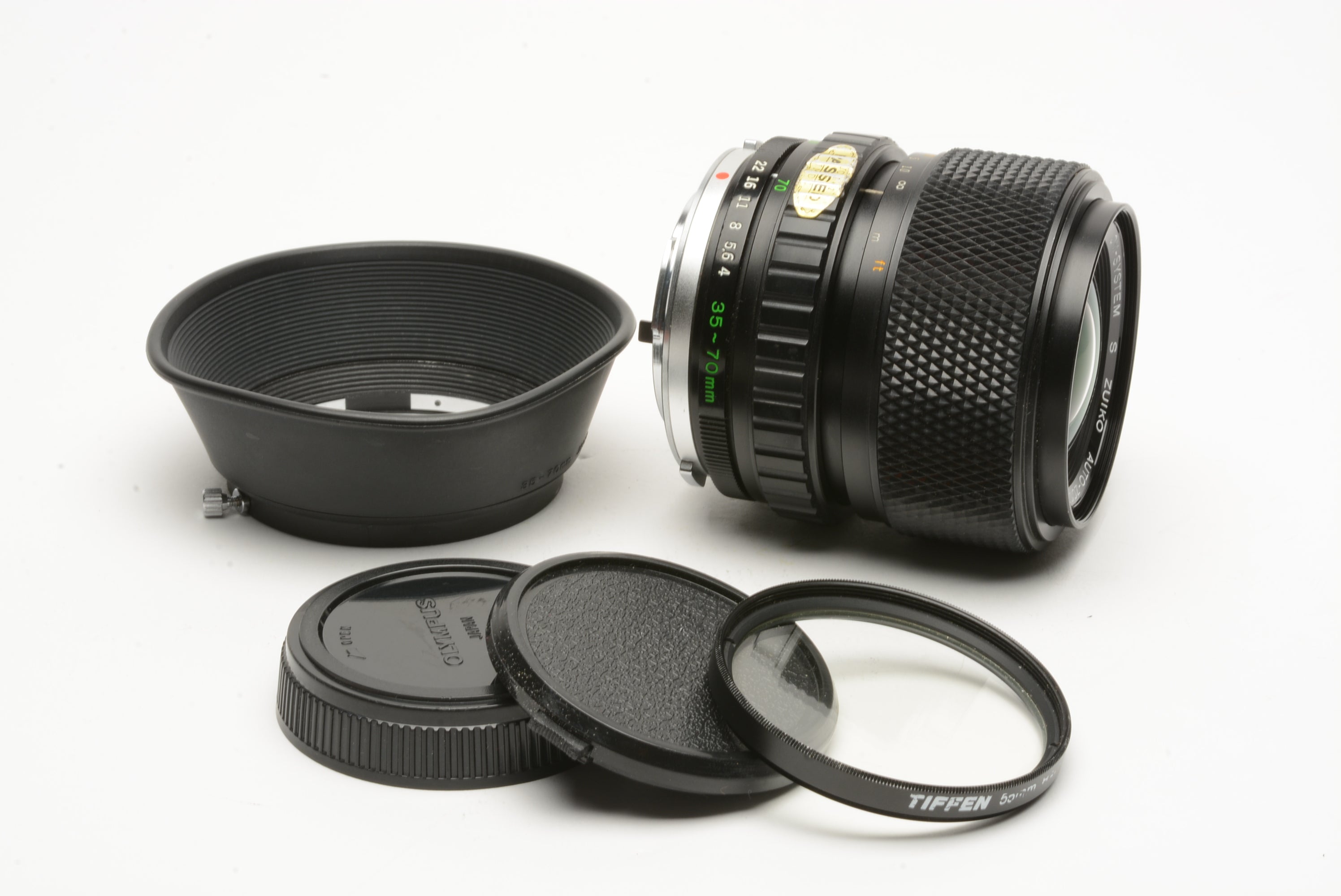 Olympus OM-System 35-70mm f4 zoom lens, hood, caps, UV – RecycledPhoto