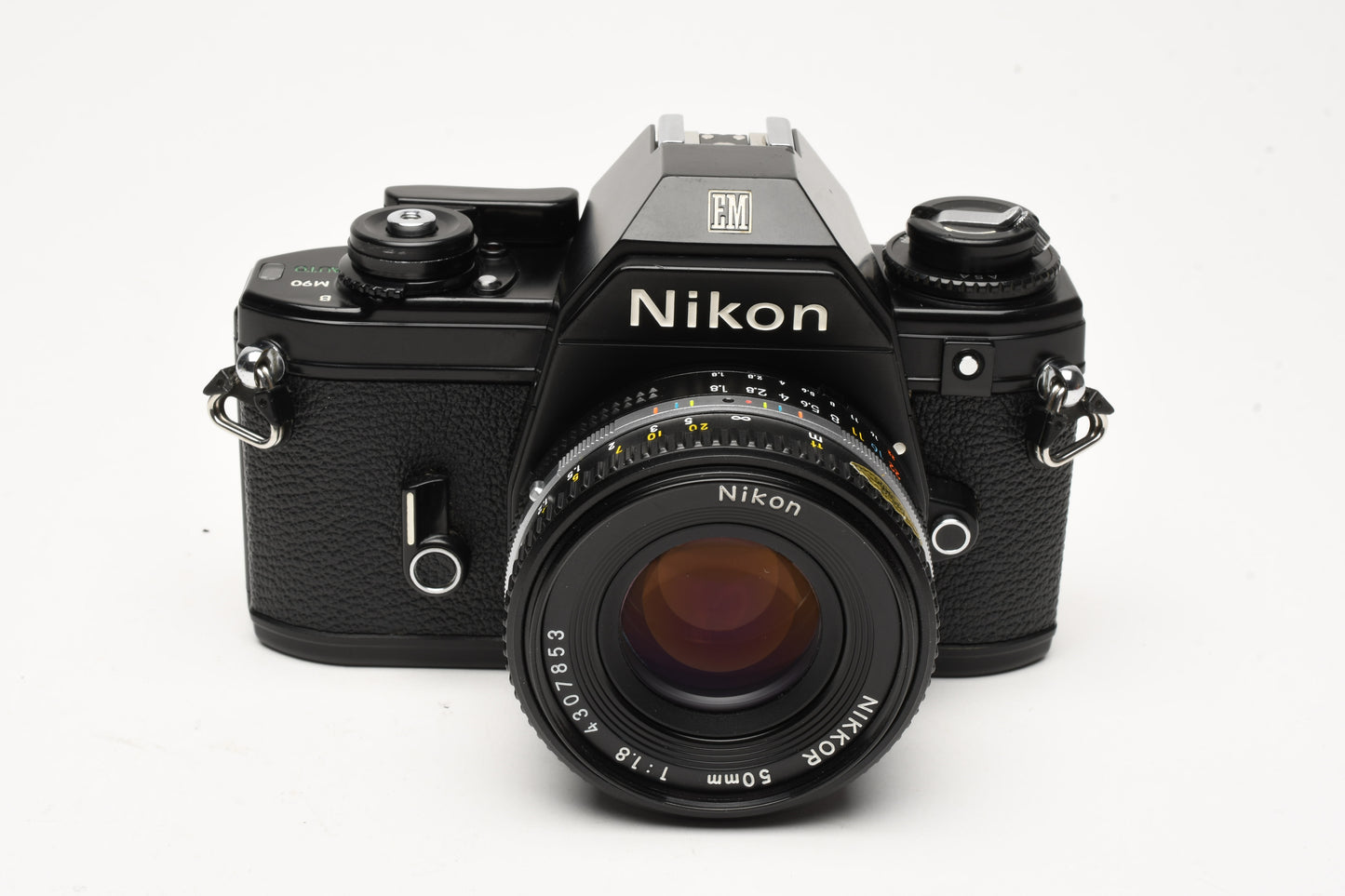 Nikon EM 35mm SLR w/Nikon Nikkor 50mm f1.8 lens, strap, cap, new seals