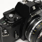 Nikon EM 35mm SLR w/Nikon Nikkor 50mm f1.8 lens, strap, cap, new seals
