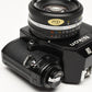Nikon EM 35mm SLR w/Nikon Nikkor 50mm f1.8 lens, strap, cap, new seals
