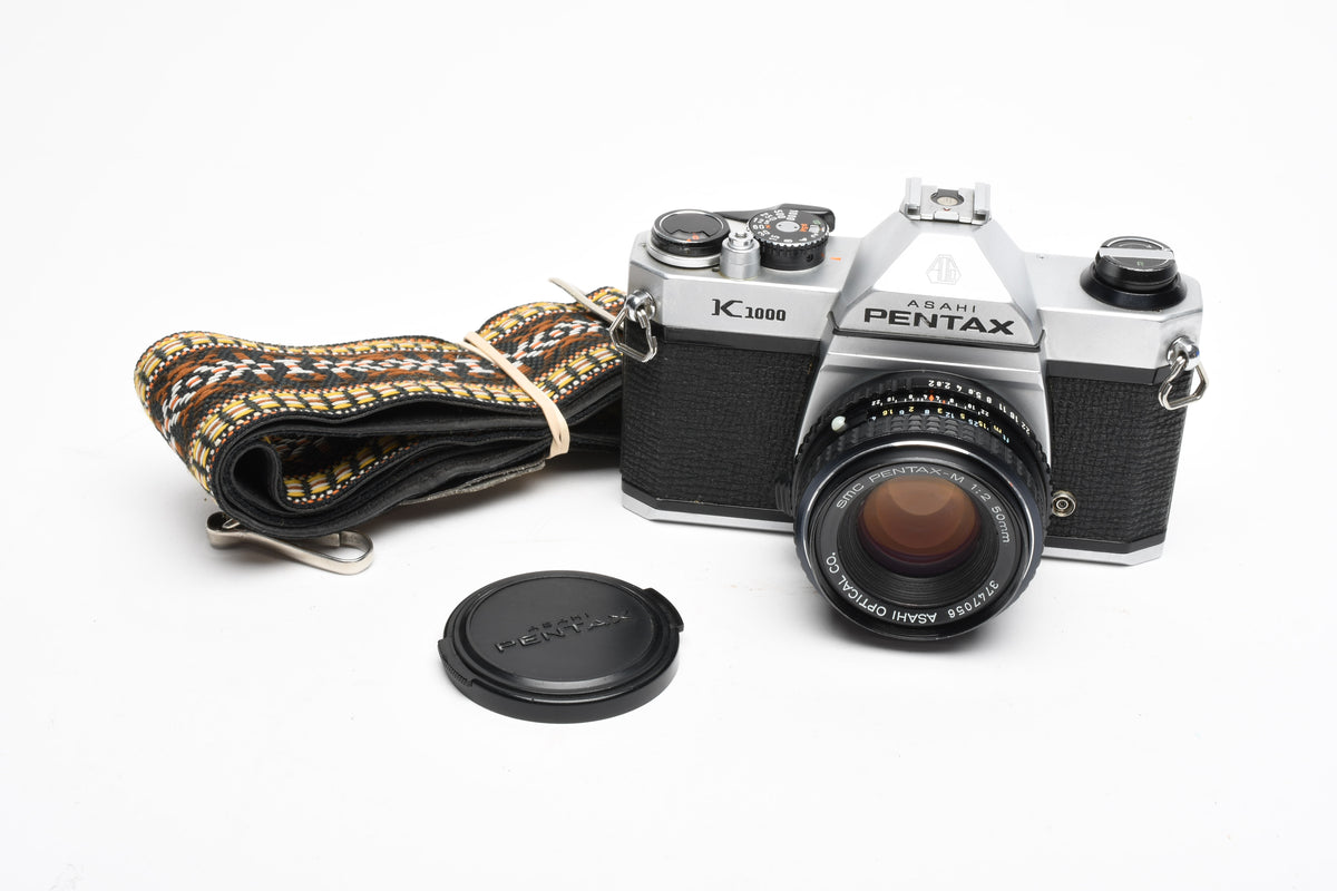 Pentax K1000 35mm SLR w/50mm f2 lens, New seals, canvas strap, Awesome