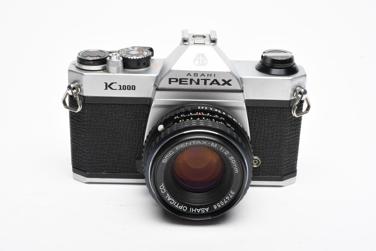 Pentax K1000 35mm SLR w/50mm f2 lens, New seals, canvas strap, Awesome