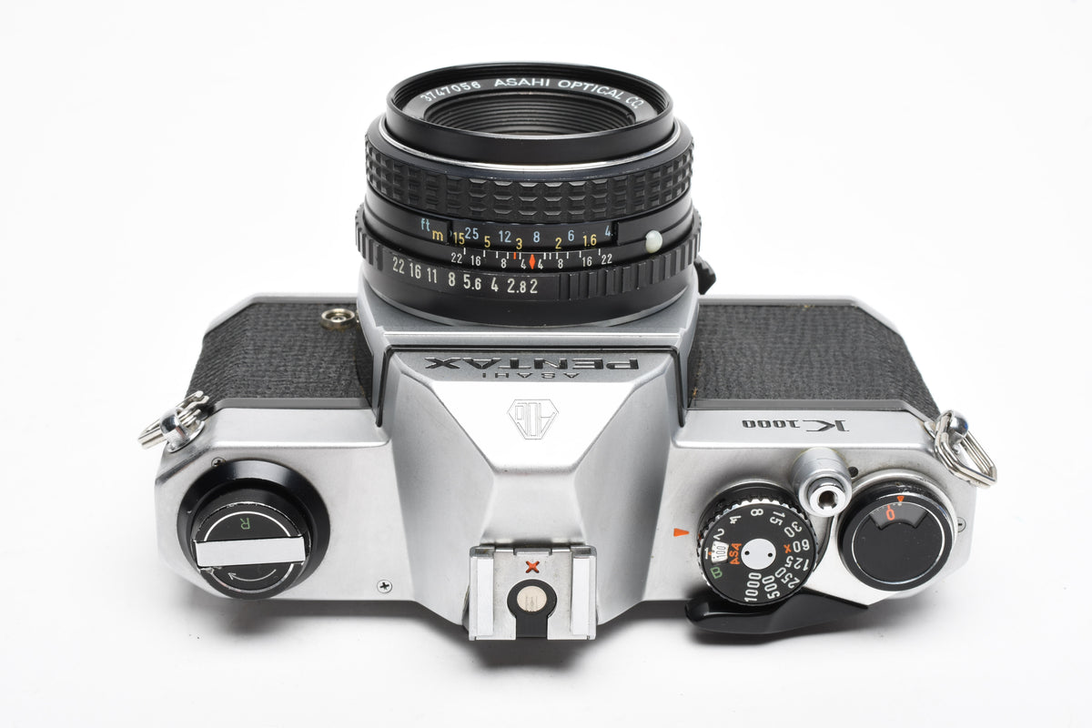 Pentax K1000 35mm SLR w/50mm f2 lens, New seals, canvas strap, Awesome