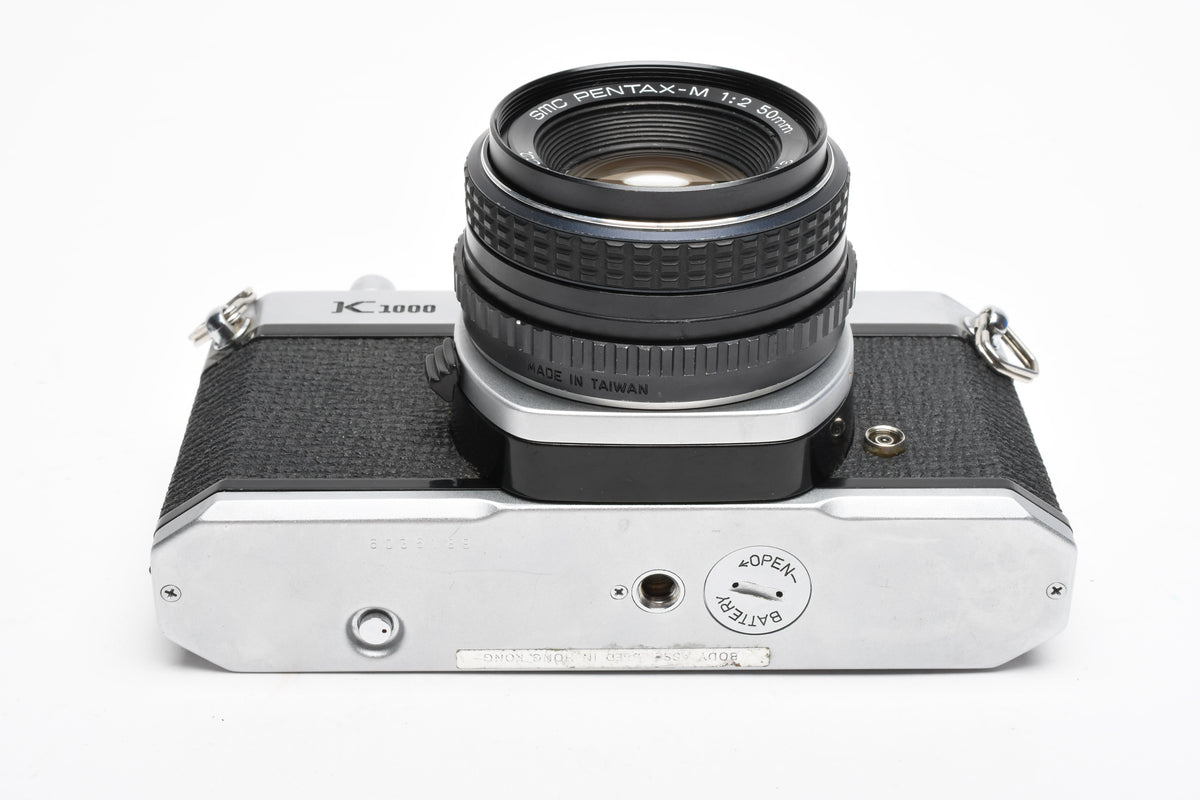 Pentax K1000 35mm SLR w/50mm f2 lens, New seals, canvas strap, Awesome