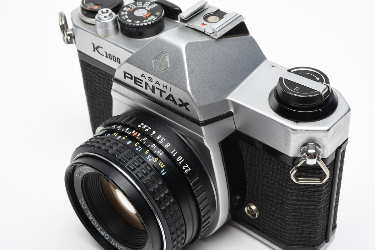 Pentax K1000 35mm SLR w/50mm f2 lens, New seals, canvas strap, Awesome