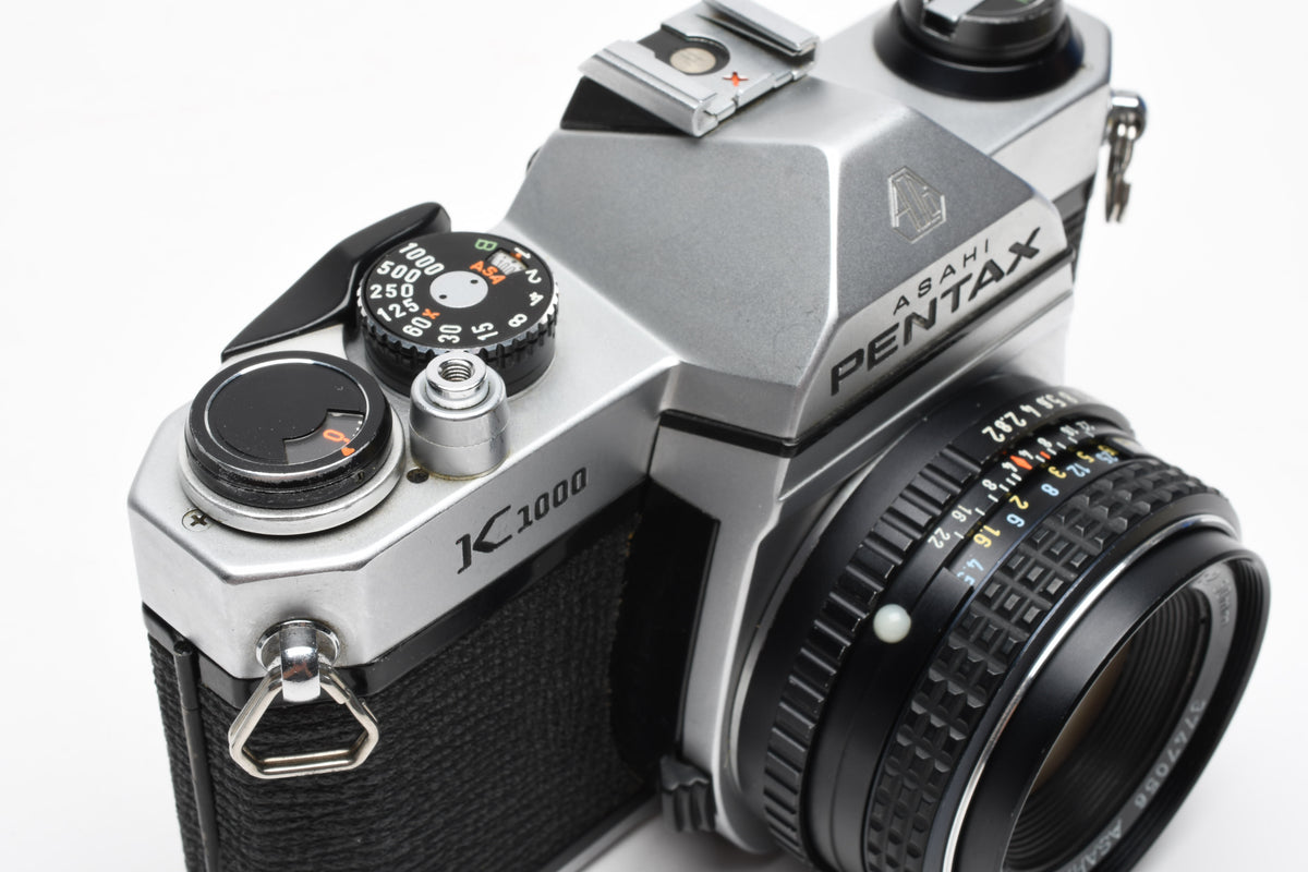 Pentax K1000 35mm SLR w/50mm f2 lens, New seals, canvas strap, Awesome