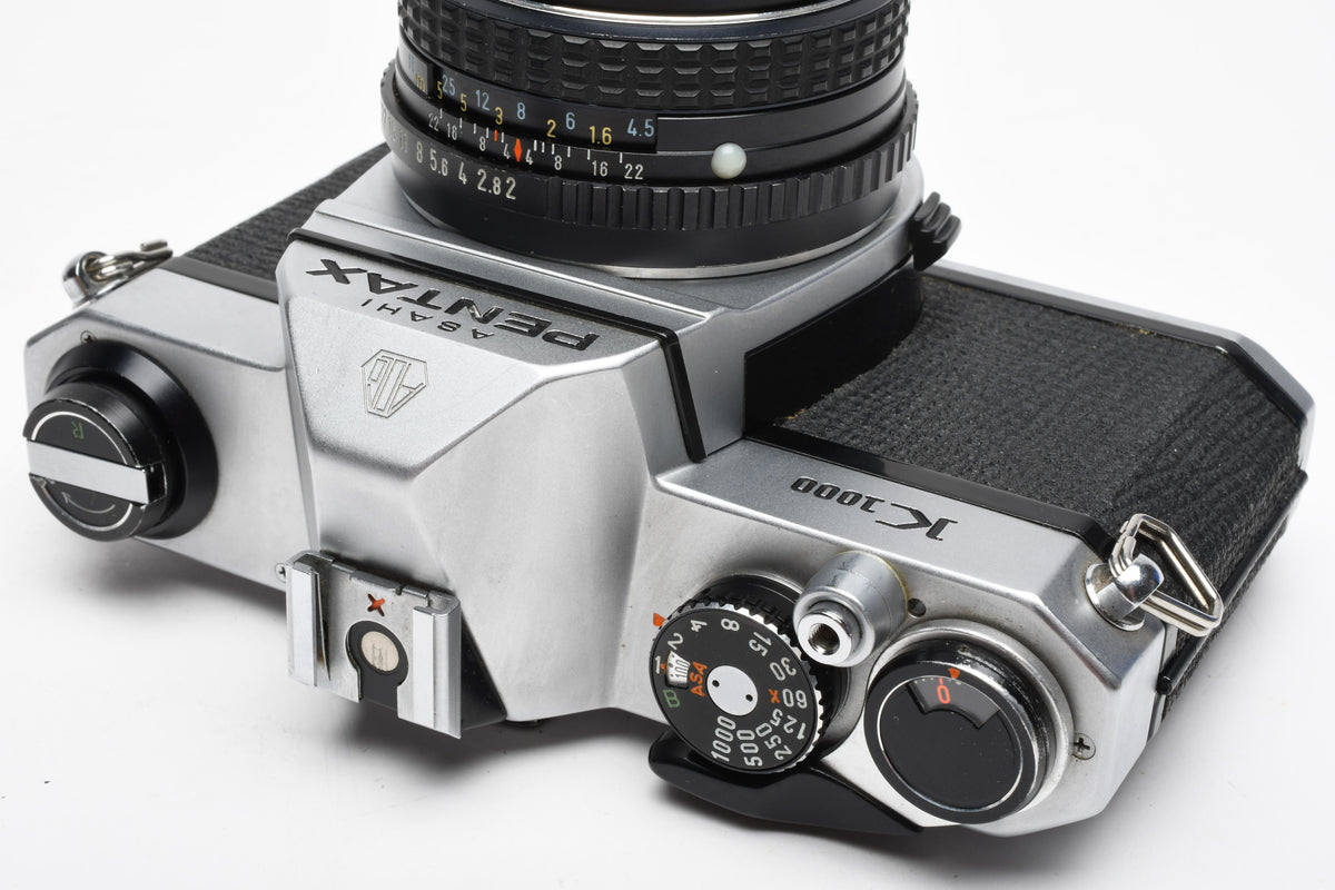 Pentax K1000 35mm SLR w/50mm f2 lens, New seals, canvas strap, Awesome
