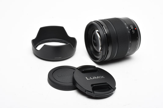 Panasonic Lumix G Vario 12-60mm f3.5-5.6 Asph. Power O.I.S. w/Hood, Caps