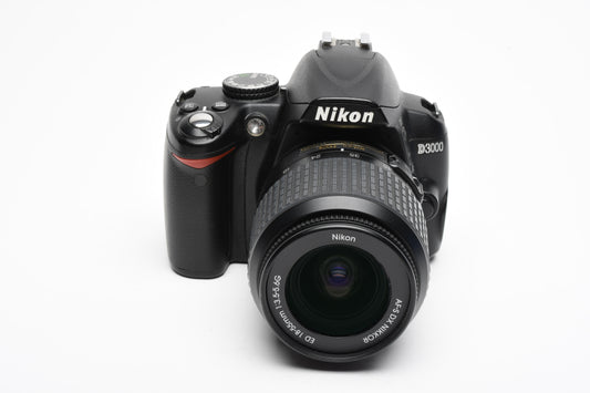 Nikon D3000 DSLR w/Nikkor AFS 18-55mm f3.5-5.6G Lens, Batt, Charger, 25K Acts