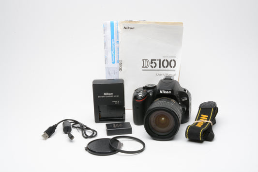 Nikon D5100 DSLR w/Nikkor 18-70mm F3.5-4.5G VR lens, 12,502 Acts, batt+charger+UV