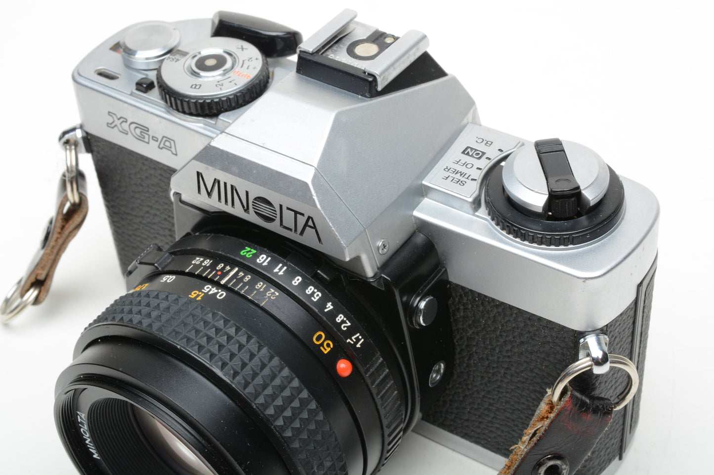 Minolta XG-A 35mm SLR w/50mm f1.7 lens, strap, cap, strap +Case, New seals, tested