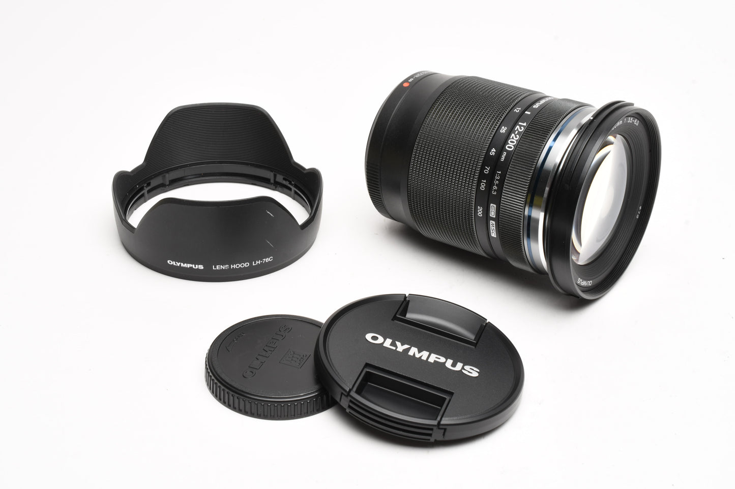 Olympus M. Zuiko Pro 12-200mm f3.5-6.3 lens, Caps, Hood, Mint-