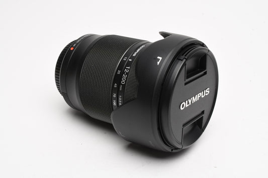 Olympus M. Zuiko Pro 12-200mm f3.5-6.3 lens, Caps, Hood, Mint-