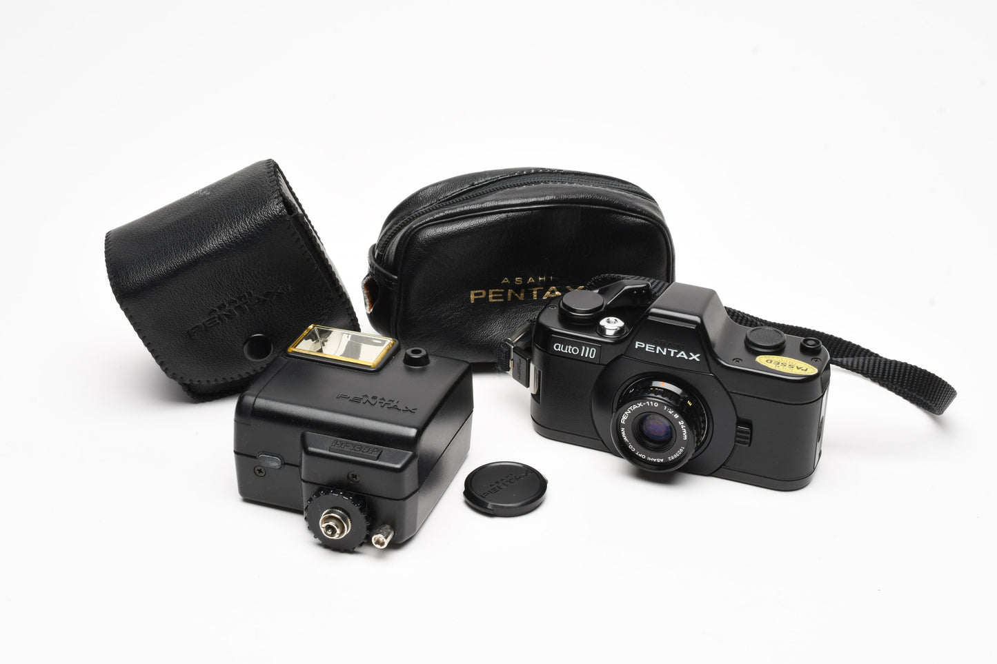 Pentax Auto 110 w/24mm f2.8, case, wrist strap, +AF130P Flash, Tested
