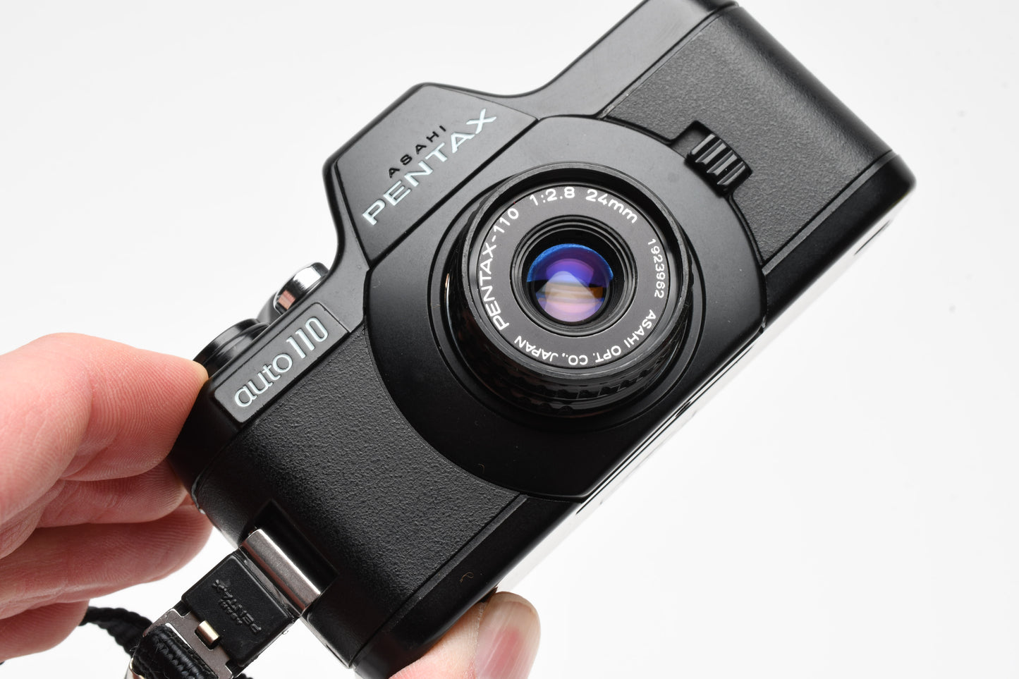 Pentax Auto 110 w/24mm f2.8, case, wrist strap, +AF130P Flash, Tested