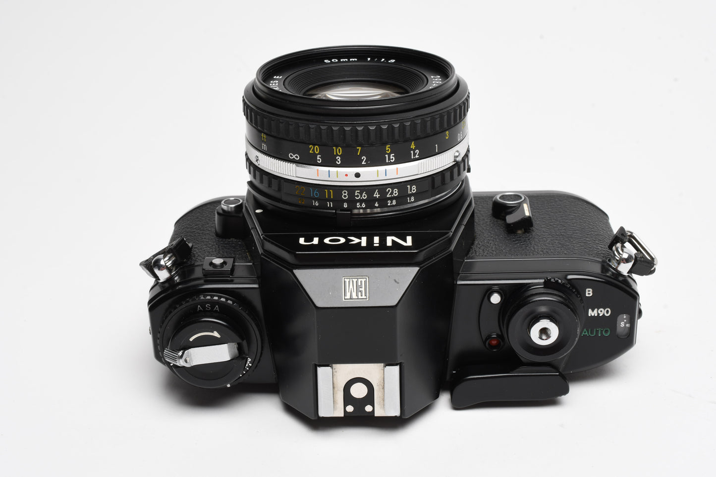 Nikon EM 35mm SLR w/Nikon Nikkor 50mm f1.8 lens, strap, cap, UV, CR, new seals