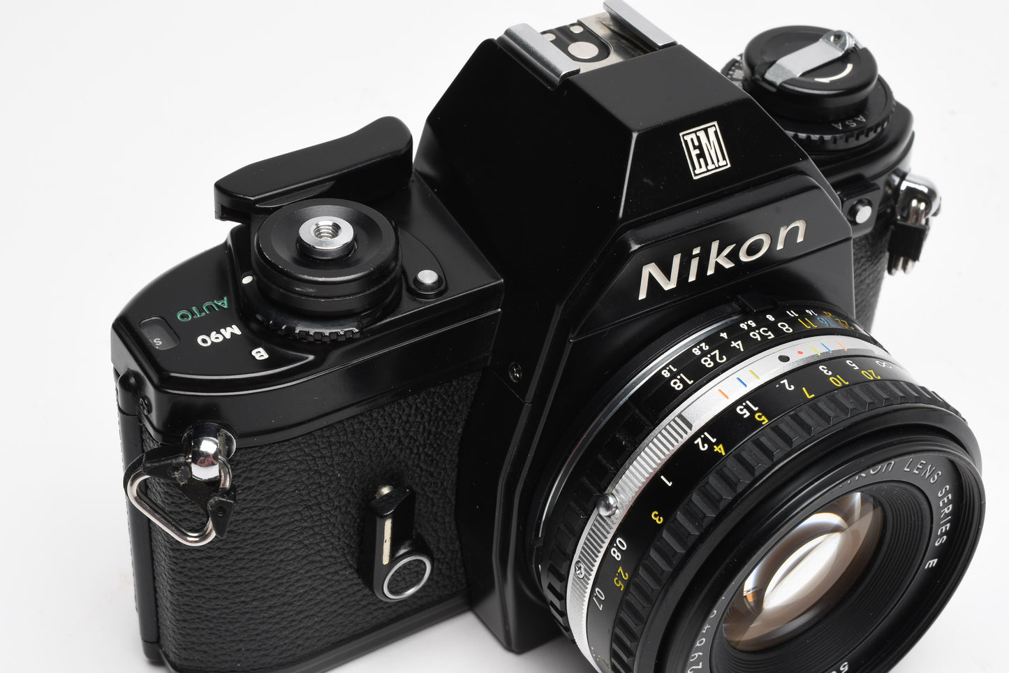 Nikon EM 35mm SLR w/Nikon Nikkor 50mm f1.8 lens, strap, cap, UV, CR, new seals