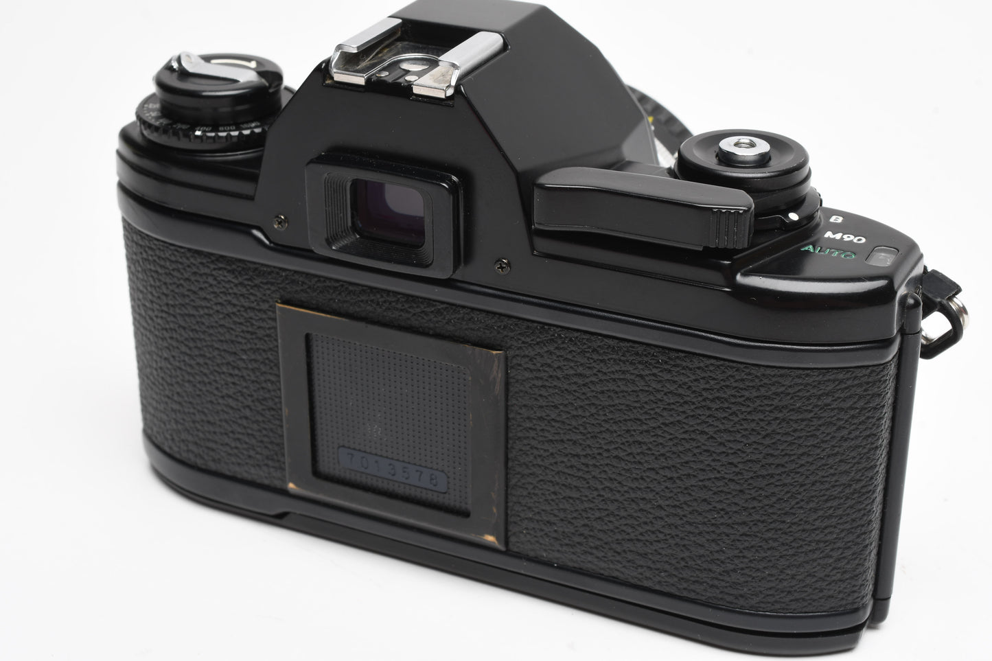 Nikon EM 35mm SLR w/Nikon Nikkor 50mm f1.8 lens, strap, cap, UV, CR, new seals