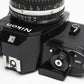 Nikon EM 35mm SLR w/Nikon Nikkor 50mm f1.8 lens, strap, cap, UV, CR, new seals