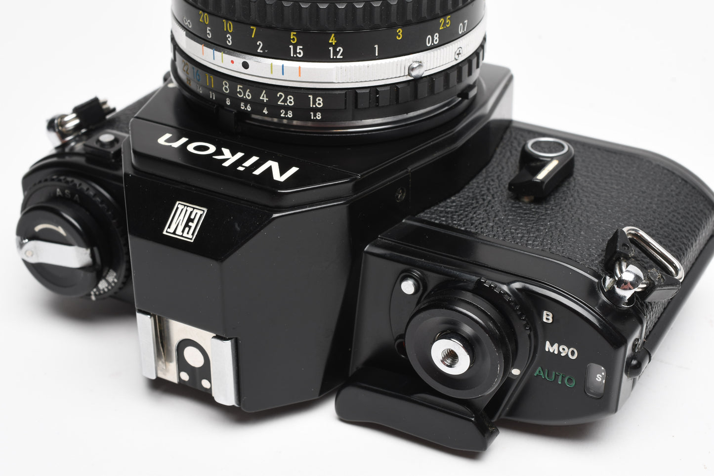Nikon EM 35mm SLR w/Nikon Nikkor 50mm f1.8 lens, strap, cap, UV, CR, new seals