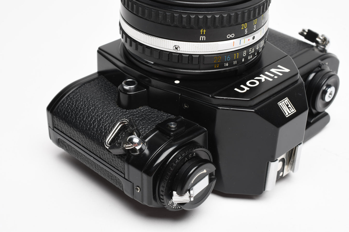 Nikon EM 35mm SLR w/Nikon Nikkor 50mm f1.8 lens, strap, cap, UV, CR, new seals