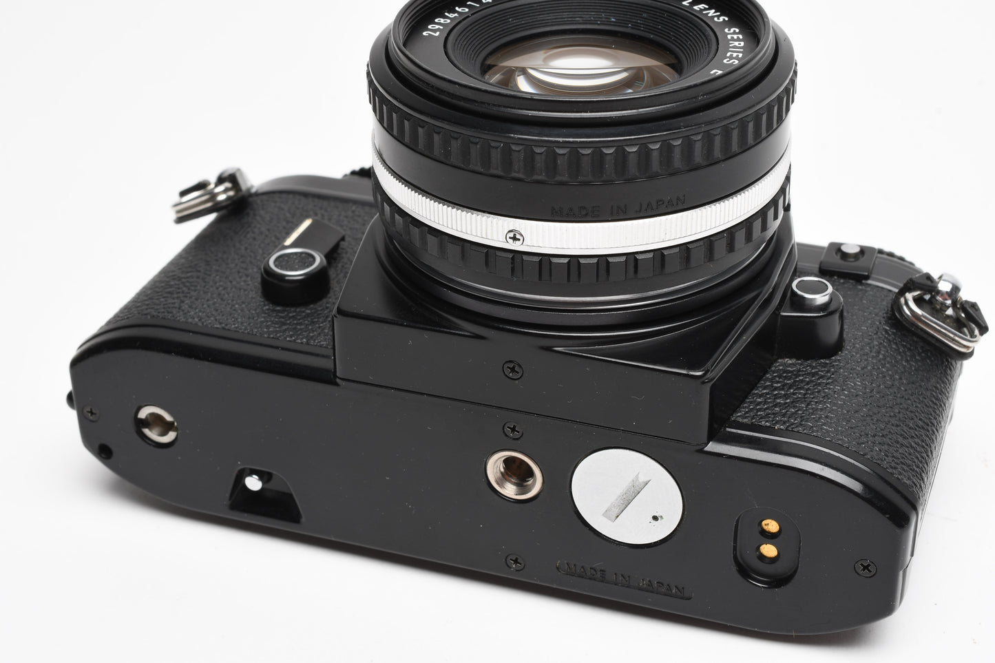 Nikon EM 35mm SLR w/Nikon Nikkor 50mm f1.8 lens, strap, cap, UV, CR, new seals