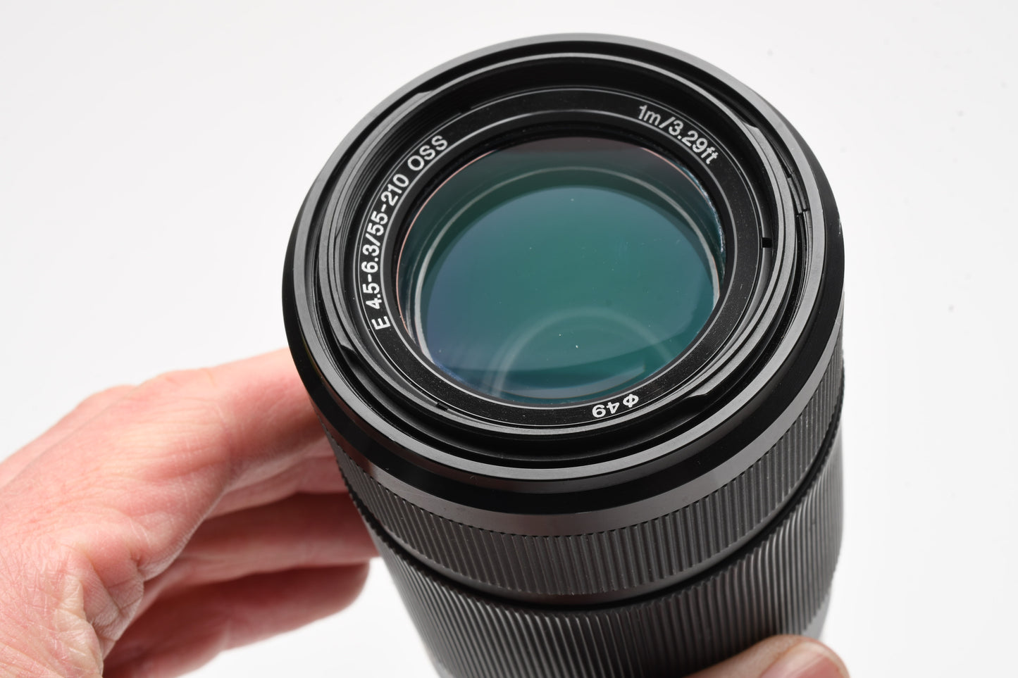 Sony 55-210mm f4.5-6.3 OSS zoom lens (Black) w/Lens caps, Lens hood