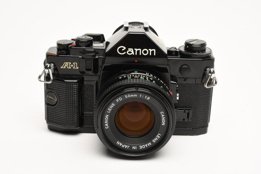 Canon A-1 A1 35mm SLR w/50mm F1.8 lens, new seals, UV, manuals, Great!