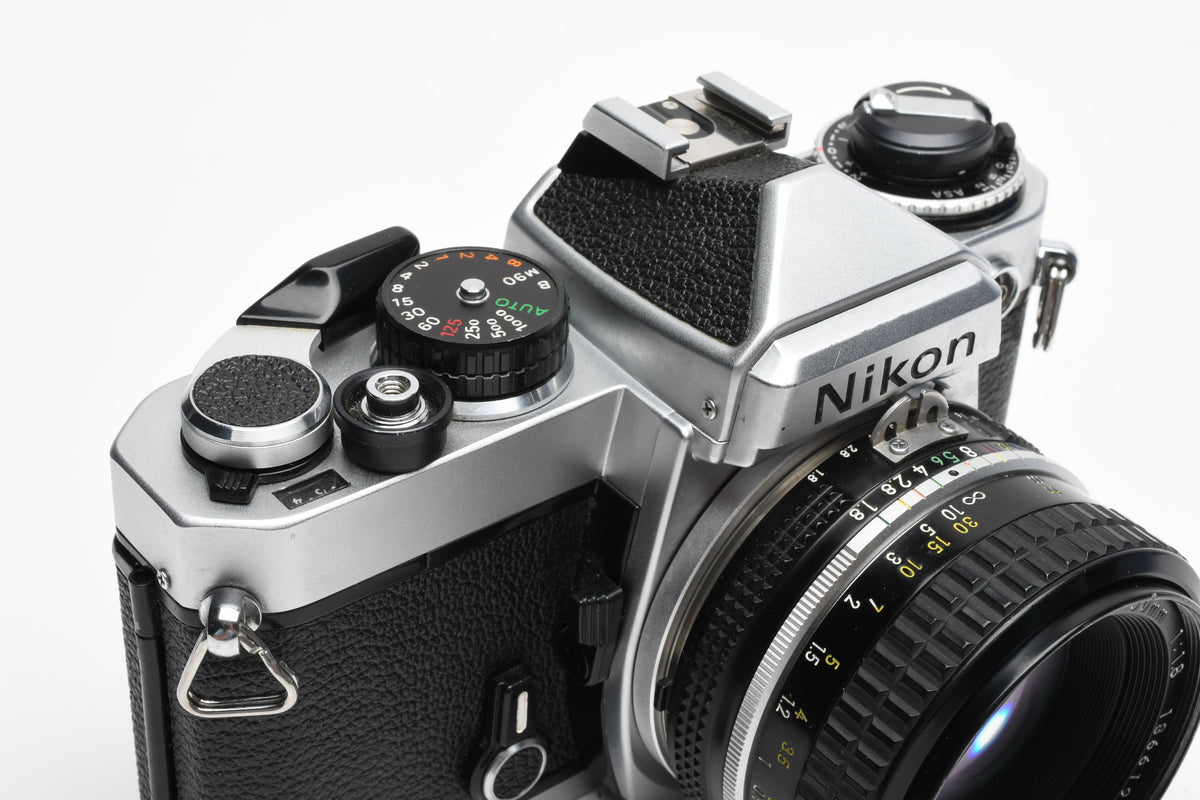 Nikon FE 35mm SLR w/Nikkor 50mm f1.8 Lens, Strap, New Seals, Great!