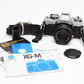 Minolta XG-M 35mm SLR w/50mm f1.7 lens, strap, cap, manuals, New seals, tested