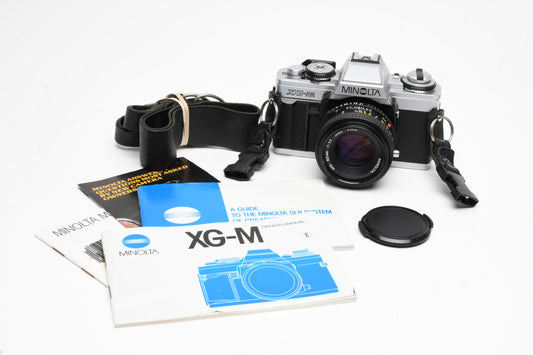 Minolta XG-M 35mm SLR w/50mm f1.7 lens, strap, cap, manuals, New seals, tested