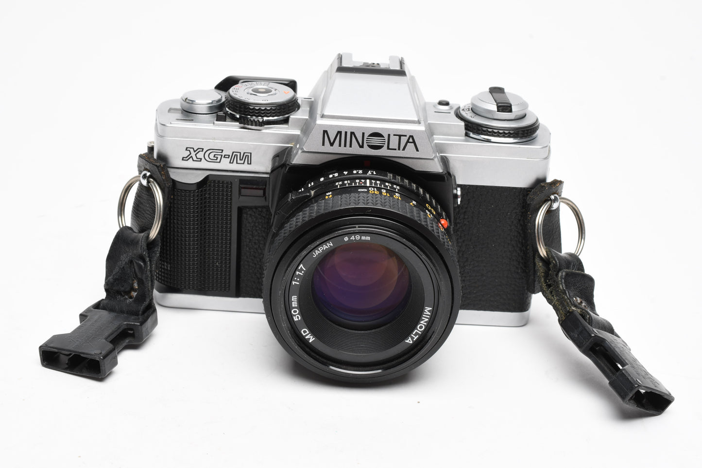Minolta XG-M 35mm SLR w/50mm f1.7 lens, strap, cap, manuals, New seals, tested