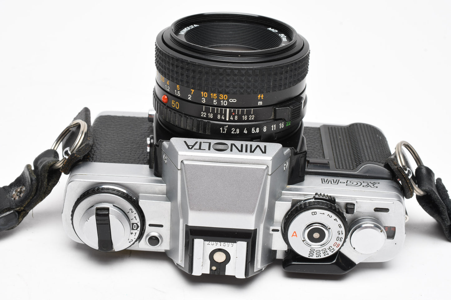 Minolta XG-M 35mm SLR w/50mm f1.7 lens, strap, cap, manuals, New seals, tested