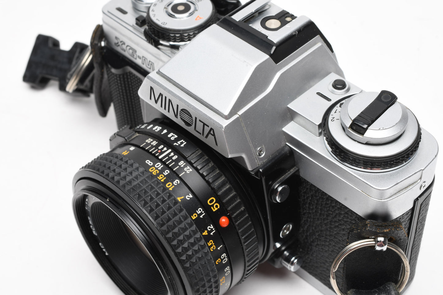 Minolta XG-M 35mm SLR w/50mm f1.7 lens, strap, cap, manuals, New seals, tested