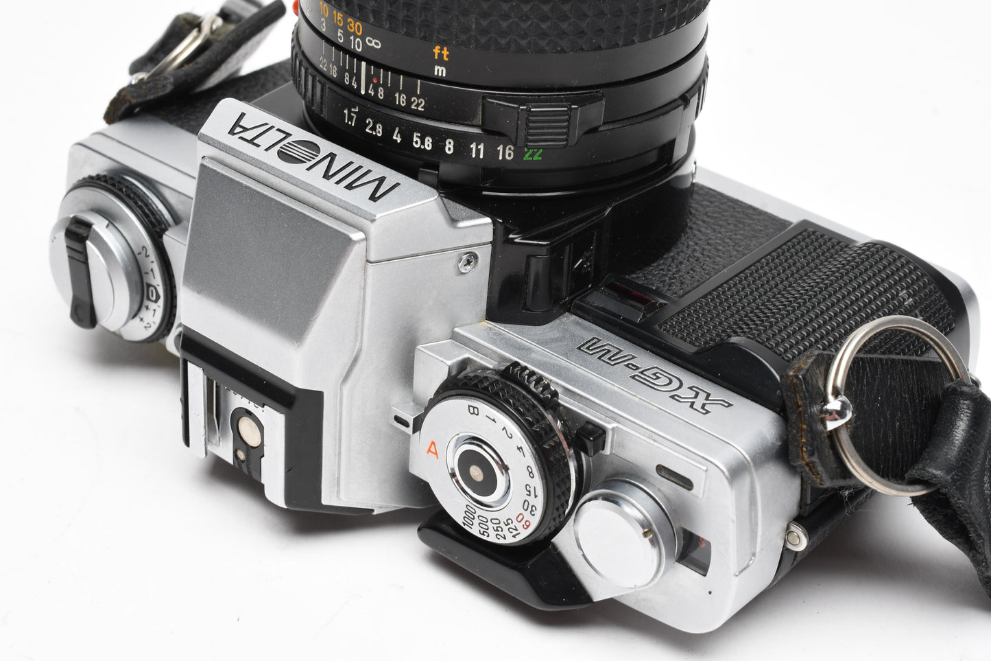 Minolta XG-M 35mm SLR w/50mm f1.7 lens, strap, cap, manuals, New seals, tested