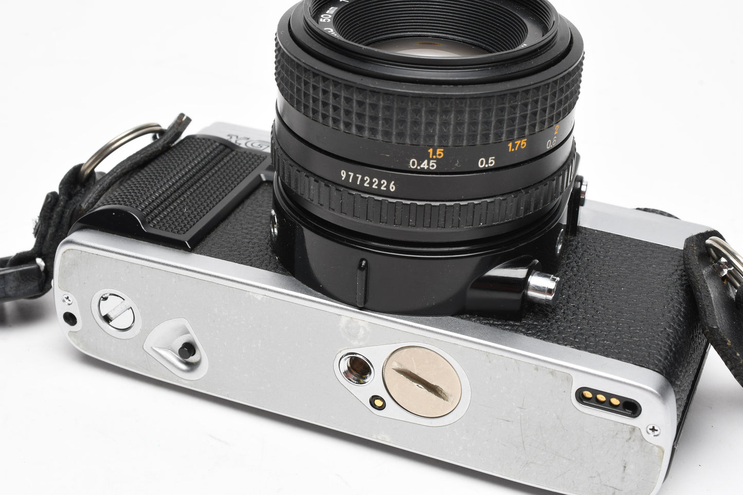 Minolta XG-M 35mm SLR w/50mm f1.7 lens, strap, cap, manuals, New seals, tested