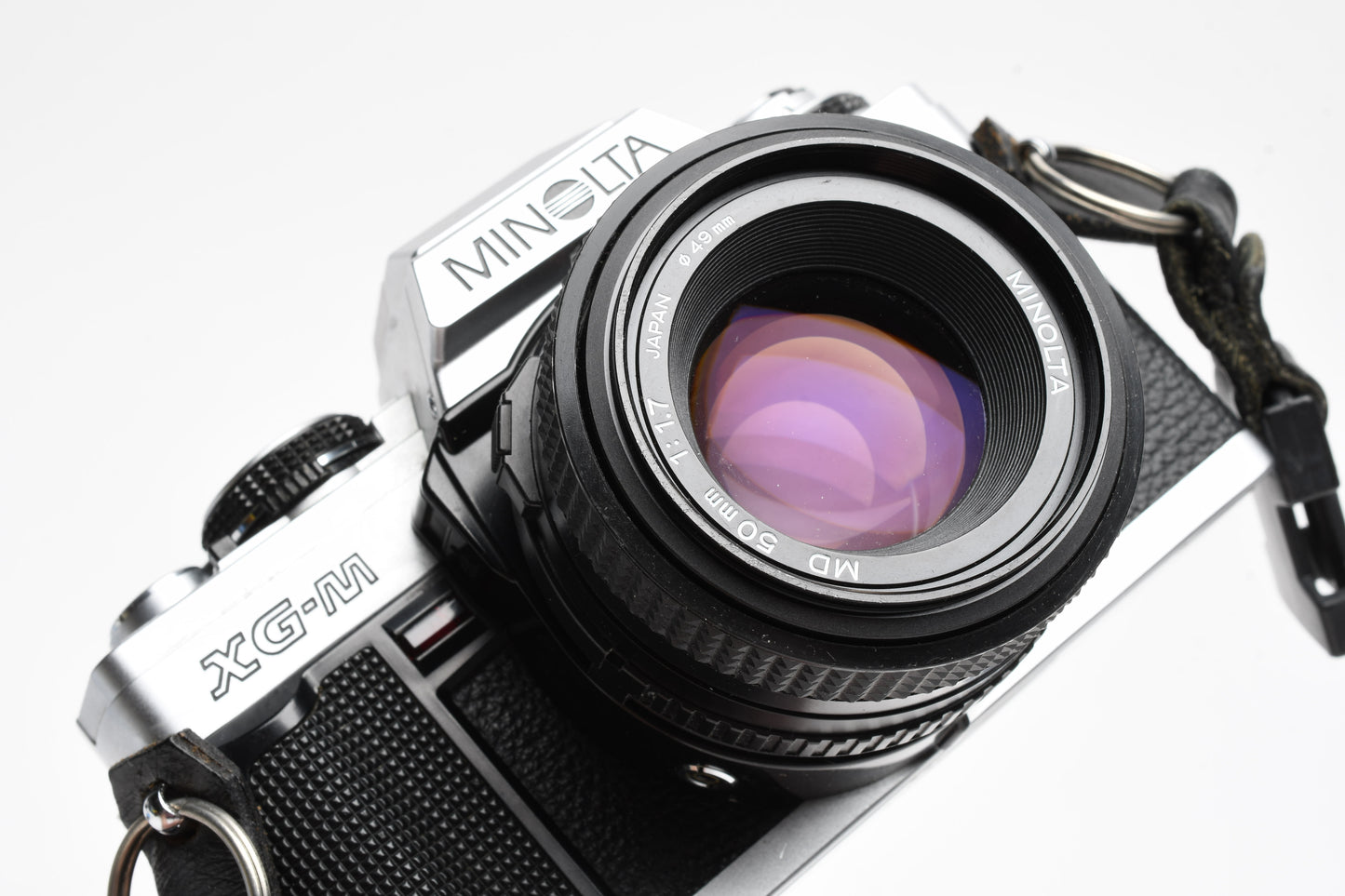 Minolta XG-M 35mm SLR w/50mm f1.7 lens, strap, cap, manuals, New seals, tested