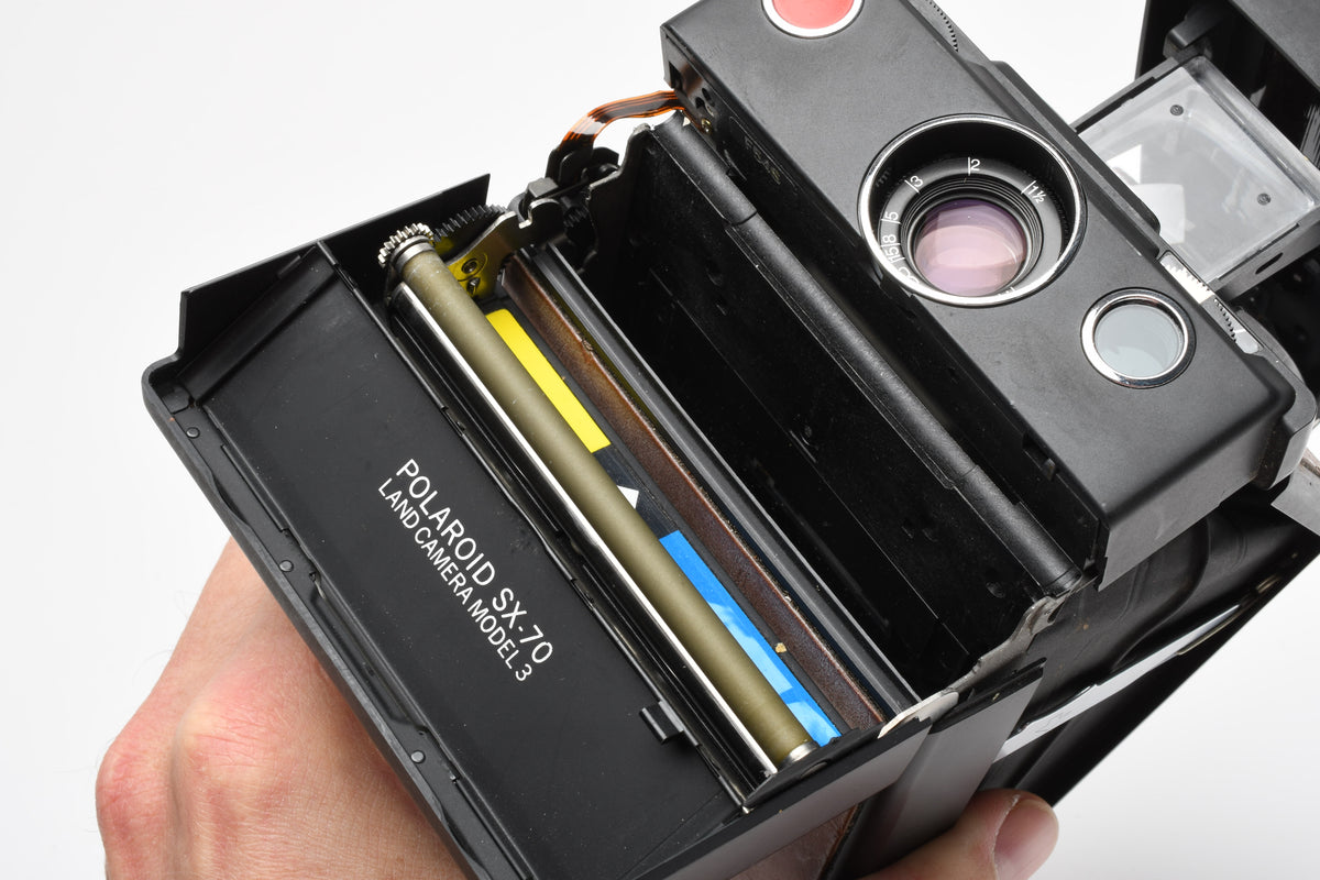 Polaroid SX70 Model 3 Black/Brown, Film tested