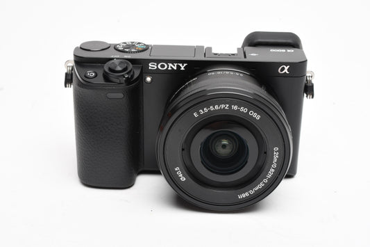 Sony A6000 Mirrorless w/16-50mm zoom, 2X batts, charger, Only 2718 Acts, Boxed