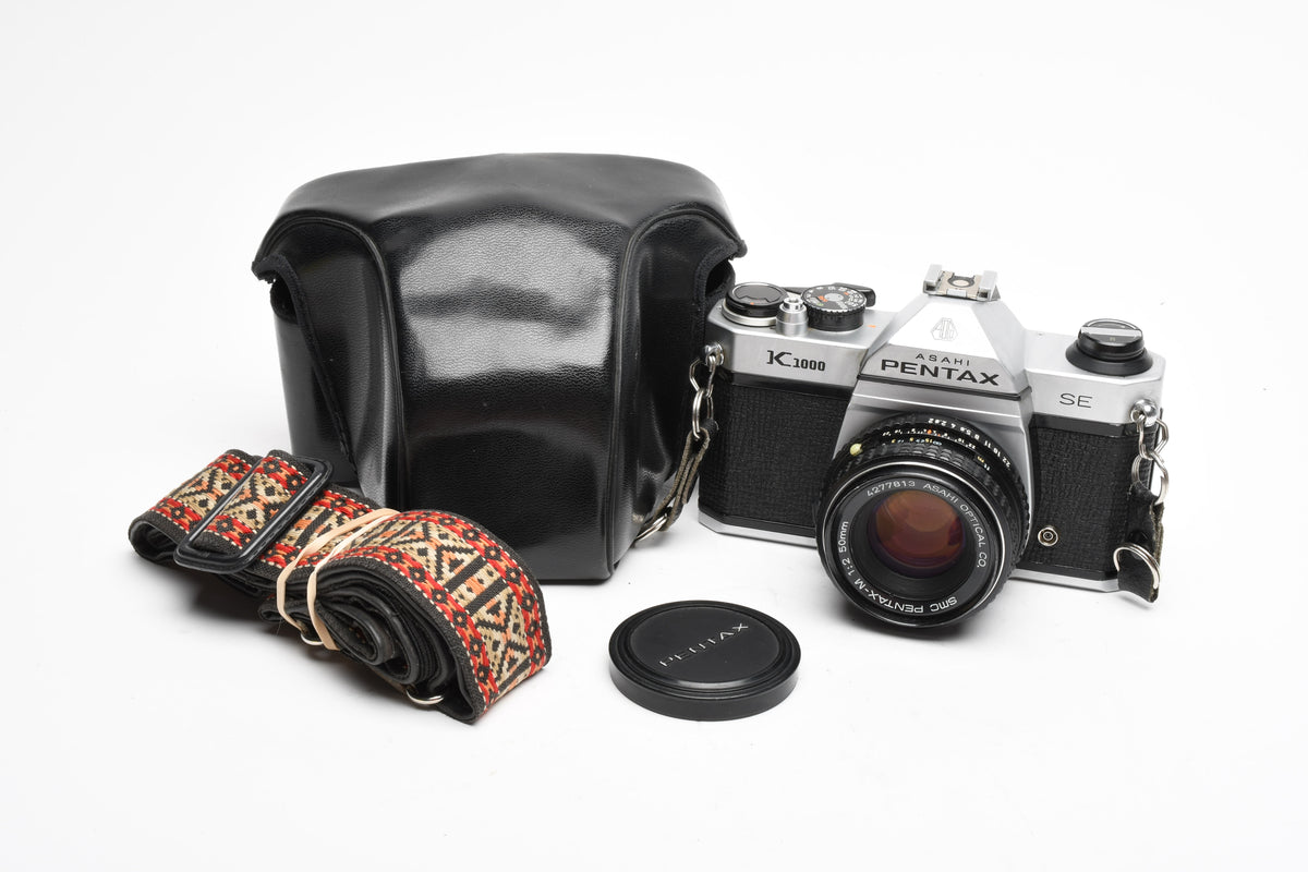 Pentax K1000 SE 35mm SLR w/50mm f2 lens, New seals, strap, case, Great!