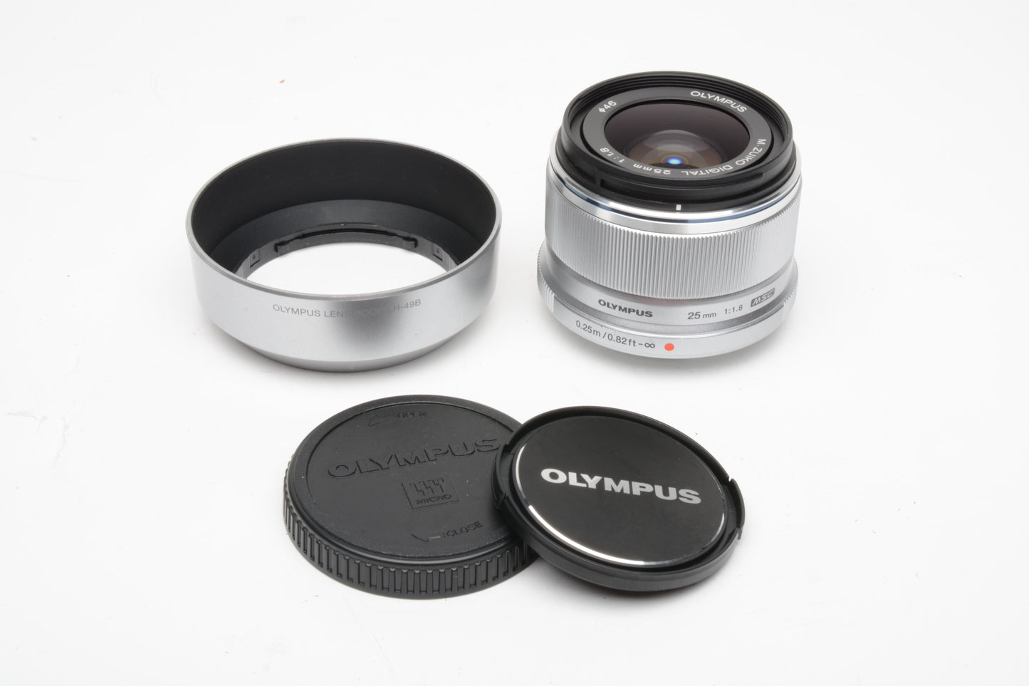 Olympus M. Zuiko 25mm f1.8 MSC lens (Silver), caps, hood, Clean